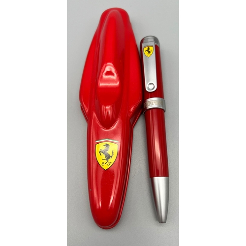 118 - An official merchandise, FERRARI writing pen, in a metal box shaped as a Formula 1 car. Produced by ... 