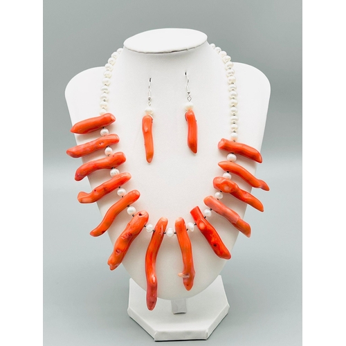 57 - A statement necklace and earrings set with genuine red corals and cultured white pearls. Coral max l... 