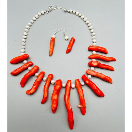 57 - A statement necklace and earrings set with genuine red corals and cultured white pearls. Coral max l... 