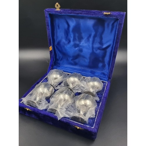 731 - A SET OF 6 SILVER PLATED GOBLETS IN A SATIN LINED VELVET PRESENTATION BOX. EACH GOBLET BEING 6cms IN... 