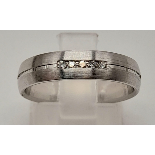 1195 - A 14 K white gold pair of rings. One wedding  band, ring size O and one half eternity diamond ring, ... 