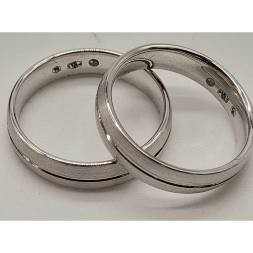 1195 - A 14 K white gold pair of rings. One wedding  band, ring size O and one half eternity diamond ring, ... 