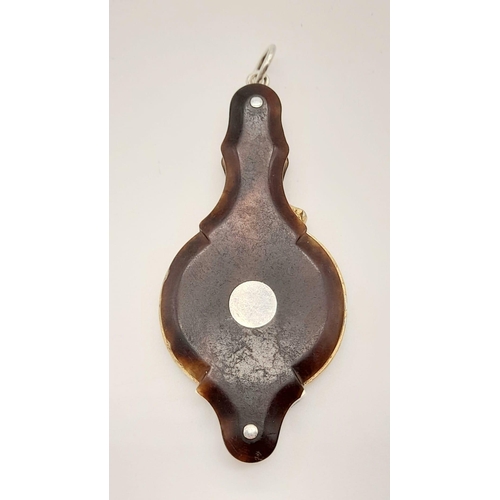 740 - A Victorian magnifying glass with tortoise shell covers. length: 6.8 cm.