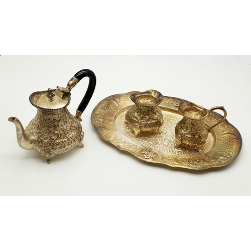 754 - An Antique Indian Silver Tea Service. Embossed foliage decoration throughout all pieces. To include:... 