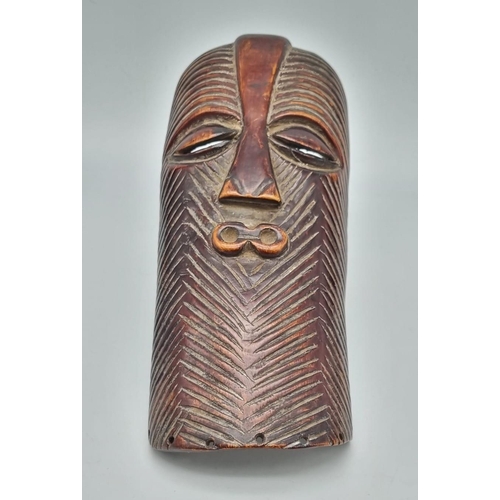 761 - An African 19th Century Congo (Lega tribe) Ivory Passport Mask. Used as a means of identification wh... 