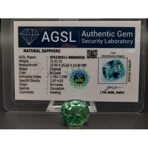 107 - A 32ct Bi-Colour Sri Lankan Sapphire. Cushion-cut with no visible marks or inclusions. Wonderful lig... 