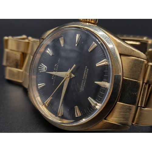 62 - An 18K Gold Rolex Oyster Gents Watch. Gold strap and case - 35mm. Black dial. Automatic movement.
92... 