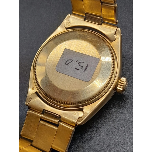 62 - An 18K Gold Rolex Oyster Gents Watch. Gold strap and case - 35mm. Black dial. Automatic movement.
92... 