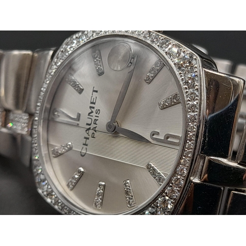 76 - An 18K White Gold Chaumet Ladies Watch. Gold and diamond bracelet and case - 28mm. Silver tone dial.... 