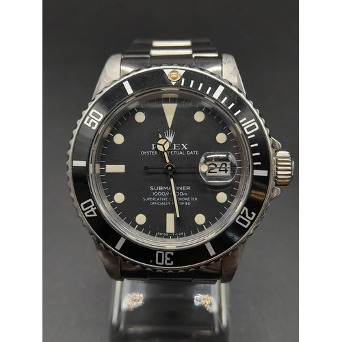 38 - A Rolex Submariner Gents Watch. Stainless steel strap and case - 40mm. Black dial and date window. A... 