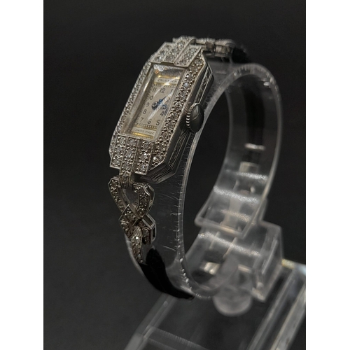 97 - An Antique (1920s) Art Deco Crusader Platinum and Diamond Ladies Watch. Platinum and diamond case. 1... 