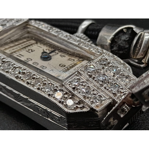 97 - An Antique (1920s) Art Deco Crusader Platinum and Diamond Ladies Watch. Platinum and diamond case. 1... 