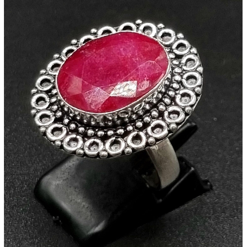 738 - A Natural Ruby Silver Ring. Size S. 7.15g.