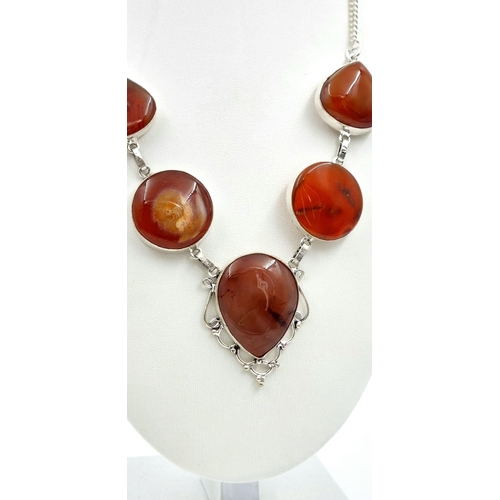 765 - A White Metal Red Agate Drop Pendant Necklace. 
44cm.