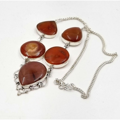 765 - A White Metal Red Agate Drop Pendant Necklace. 
44cm.