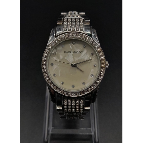 1187 - A LADIES DIAMONTE DRESS WATCH BY RIVER ISLAND WITH MOTHER OF PEARL FACE