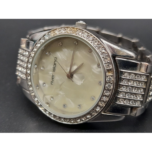 1187 - A LADIES DIAMONTE DRESS WATCH BY RIVER ISLAND WITH MOTHER OF PEARL FACE