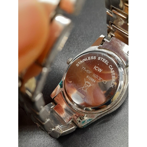 1187 - A LADIES DIAMONTE DRESS WATCH BY RIVER ISLAND WITH MOTHER OF PEARL FACE