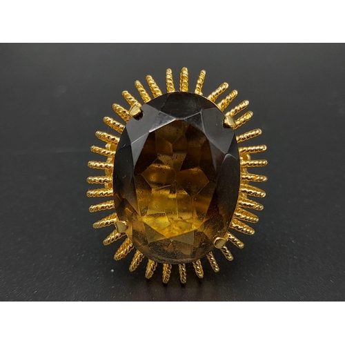 31 - An 18 K yellow gold ring with a massive, oval cut, smoky quartz. Ring size: R, weight: 12.73 g.