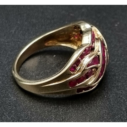 81 - 10K yellow gold ruby set twist ring, size N, total weight 4.9 grams