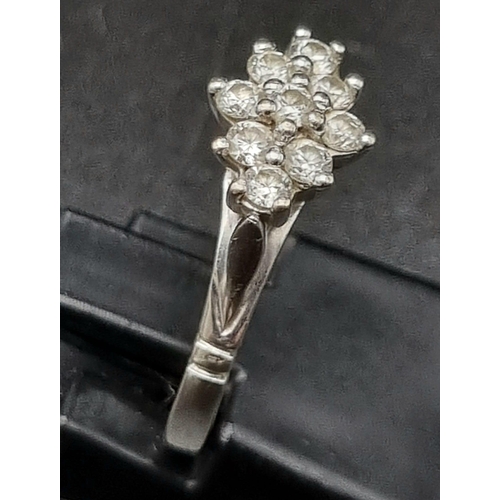 67 - 18k white gold diamond cluster ring, 0.40ct of diamonds, ring size N, total weight 2.9 grams