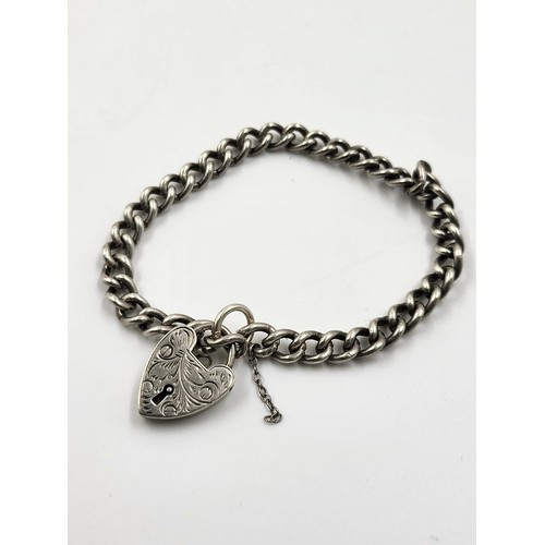 742 - An Early Solid Silver Bracelet with Heart Clasp. 18cm.
15.5g