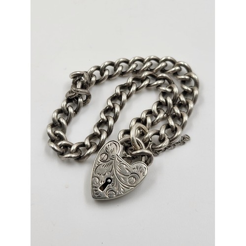 742 - An Early Solid Silver Bracelet with Heart Clasp. 18cm.
15.5g