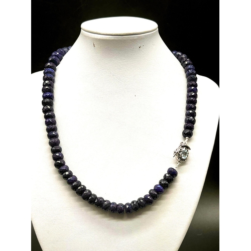 756 - A 460ct Single Strand Blue Sapphire Necklace with Blue Topaz Clasp in 925 Silver. 44cm.