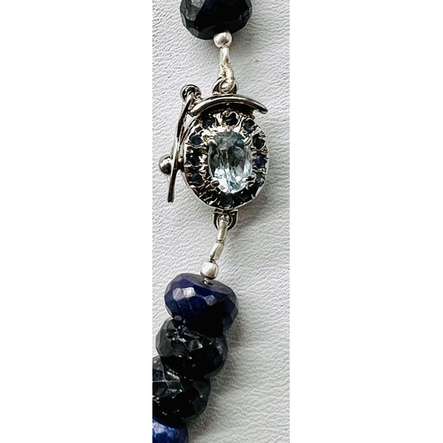 756 - A 460ct Single Strand Blue Sapphire Necklace with Blue Topaz Clasp in 925 Silver. 44cm.