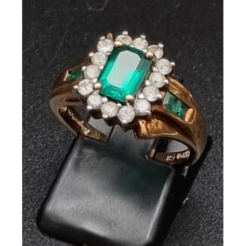 763 - A 10K Yellow Gold Green and White Stone Ring.
Size M. 3.5g - Plus two yellow metal and colourful sto... 