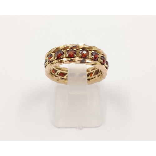 52 - A vintage, 9 K yellow gold, full eternity ring with garnets. Ring size: M, weight: 5.27 g. In a pres... 