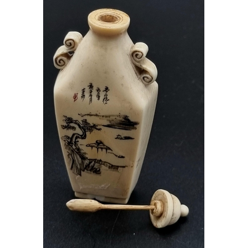 29 - A 19th Century, carved ivory snuff bottle from the Orient. Unusual shape, good engraving and calligr... 