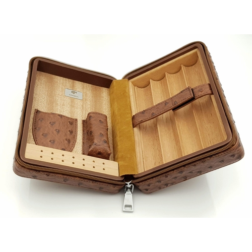 105 - A luxurious, COHIBA traveling cigar humidor, covered with ostrich leather and lined with cedar wood,... 