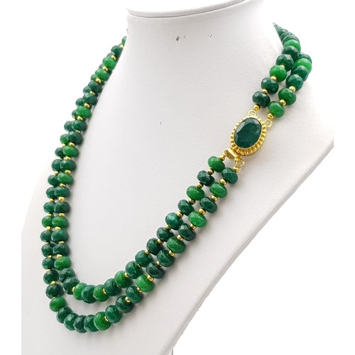 154 - A statement, two row, faceted, emerald necklace. Length: 45-48 cm, weight: 74.3 g.