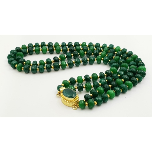 154 - A statement, two row, faceted, emerald necklace. Length: 45-48 cm, weight: 74.3 g.