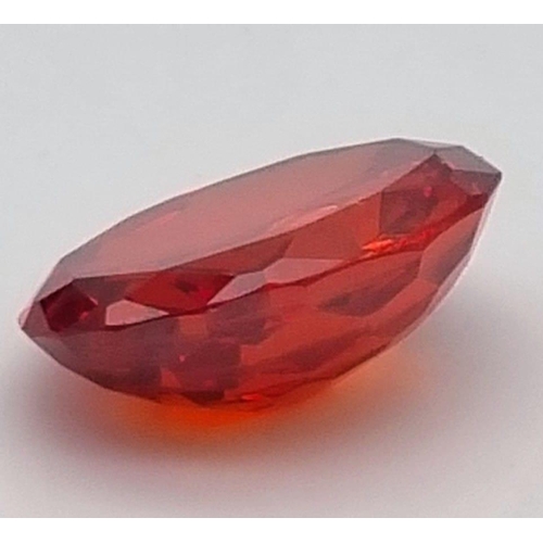 210 - An amazing, large (88.9 carats) natural zircon in vivid orange hues. Oval cut, not colour enhanced, ... 