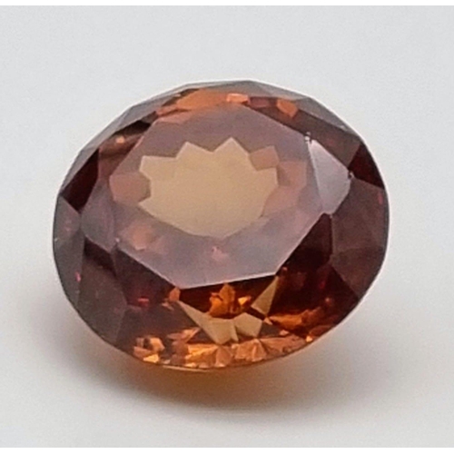 245 - A large (127 carats), flawless, round cut, natural zircon. Beautiful champagne colour with good satu... 