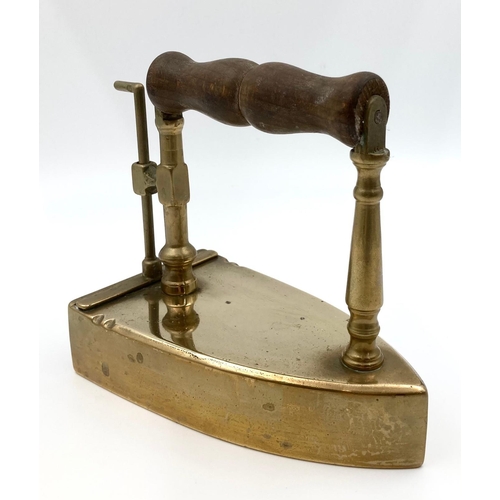 986 - An Antique Victorian Brass Sad Iron. Comes with removable iron block. 16 x 16cm