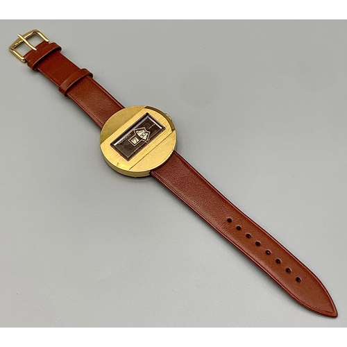 115 - A Rare Vintage Ingersoll Jumping Hour Gents Watch. Mechanical self wind movement. Leather strap. Two... 