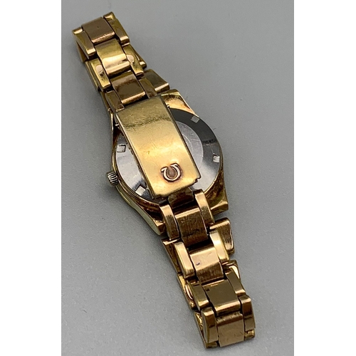 560 - A Gold Plated Omega Automatic Ladies Watch. Case - 27mm. Gold dial with date window. In working orde... 