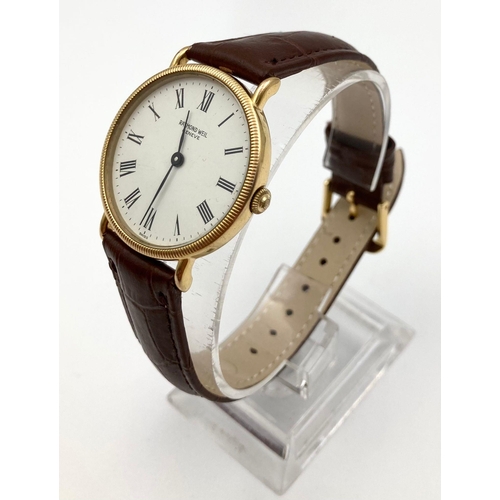 230 - A Raymond Weil Quartz Gents Watch. Leather strap. Two-tone case - 32mm. White dial. In working order... 