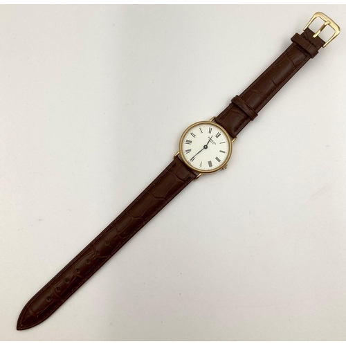 230 - A Raymond Weil Quartz Gents Watch. Leather strap. Two-tone case - 32mm. White dial. In working order... 