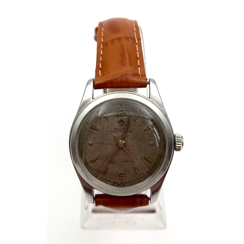 25 - A Vintage Rolex Royal 6144 Mechanical Watch. Leather strap. Stainless steel case - 32mm. Dial is sli... 