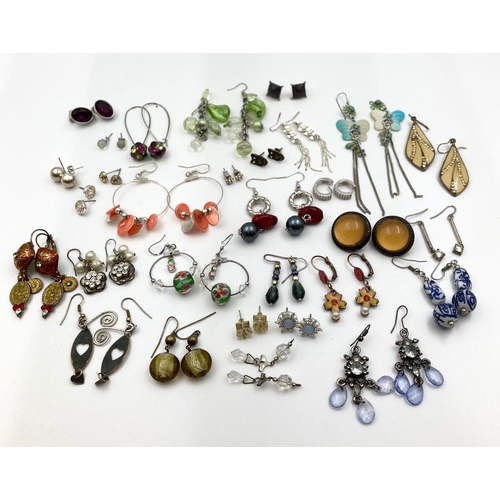 984 - An Eclectic Mix of Over Twenty Pairs of Earrings.