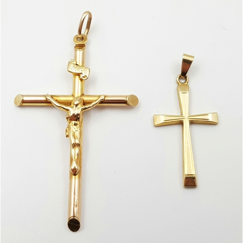 145 - A lot of seven items all 9 K yellow gold, including a crucifix with Jesus on it (51 x 32 mm), two ri... 