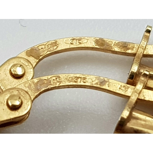 145 - A lot of seven items all 9 K yellow gold, including a crucifix with Jesus on it (51 x 32 mm), two ri... 