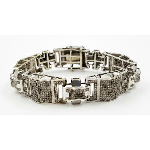 20 - A 10 K white gold bracelet with sapphires (some missing). Length: 18 cm, weight: 34.7 g.