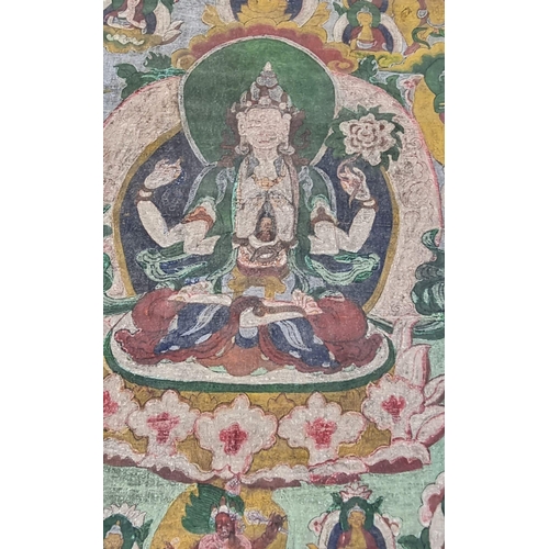 49 - An Early 19th Century Tibetan Thangka Artwork. A painted cloth brocade depicting a Buddhist Deity in... 