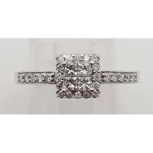 461 - An 18K White Gold Diamond Cluster Ring. 0.38ct. Size N.
3.6g