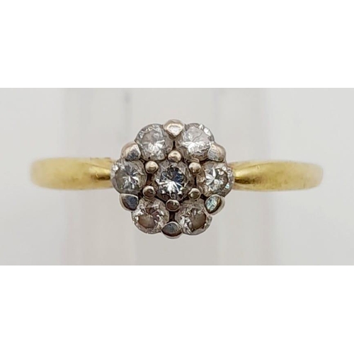 474 - An 18K Yellow Gold Diamond Cluster Ring. Seven diamonds. 0.33ct. Size P 1/2. 2.9g.